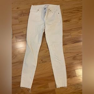 Loft white skinny jeans with distressed hem